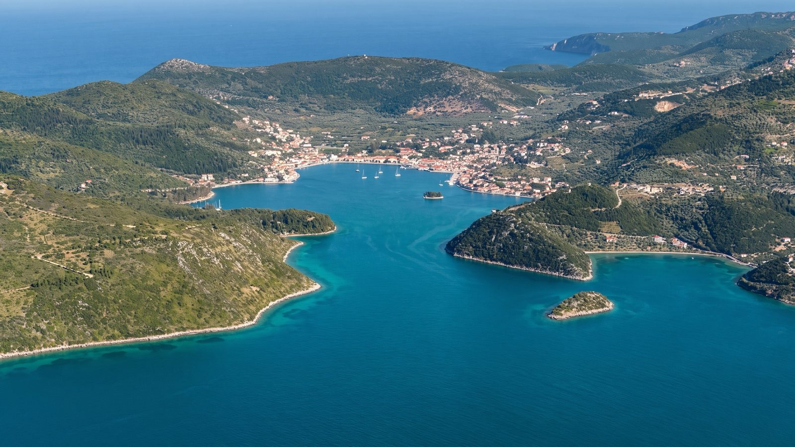 Vathy, Ithaca from the air: the narrow entrance and the town around the closed bay