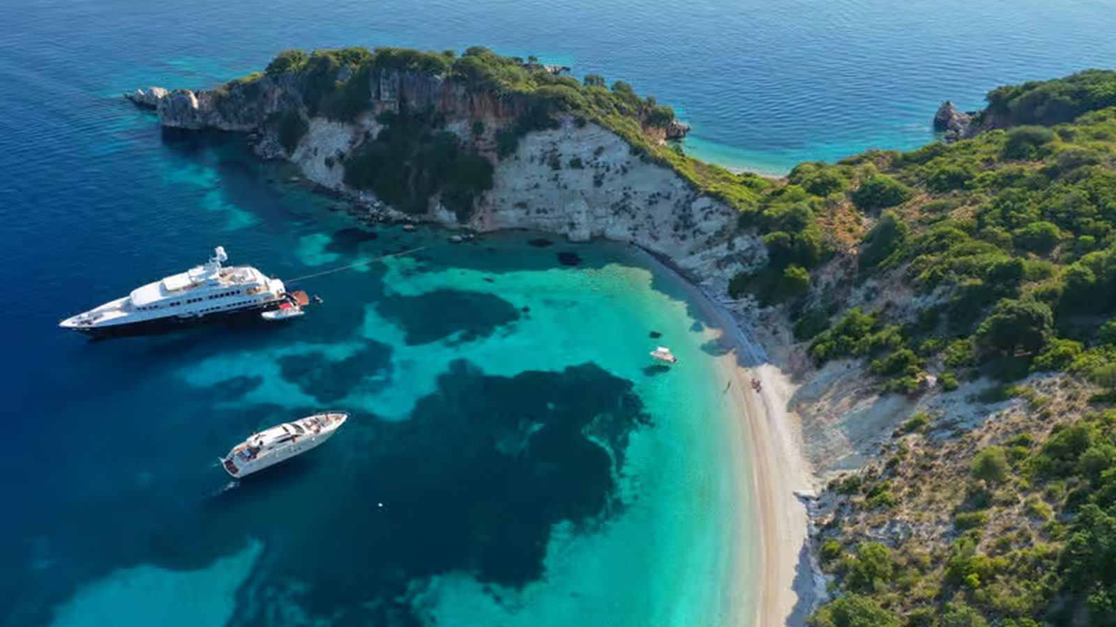Gidaki beach on the east coast of Ithaca, white pebbles and turquoise water under the cliffs