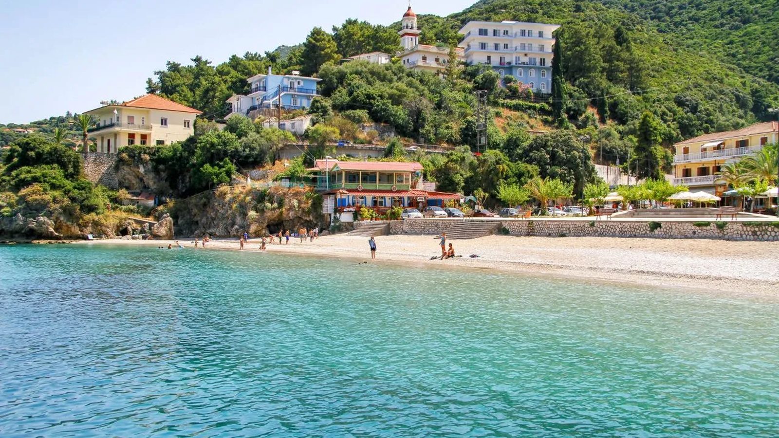 Poros, Kefalonia: the town beach and tavernas seen from the water