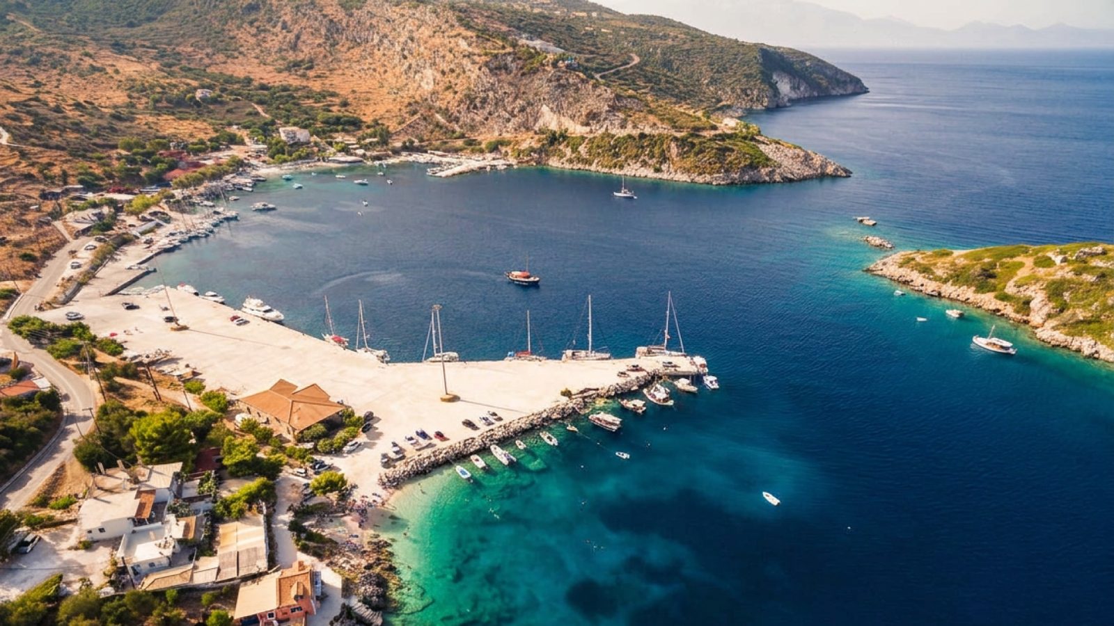 Agios Nikolaos, Zakynthos from the air: the small harbour, the quay and the islet across the bay