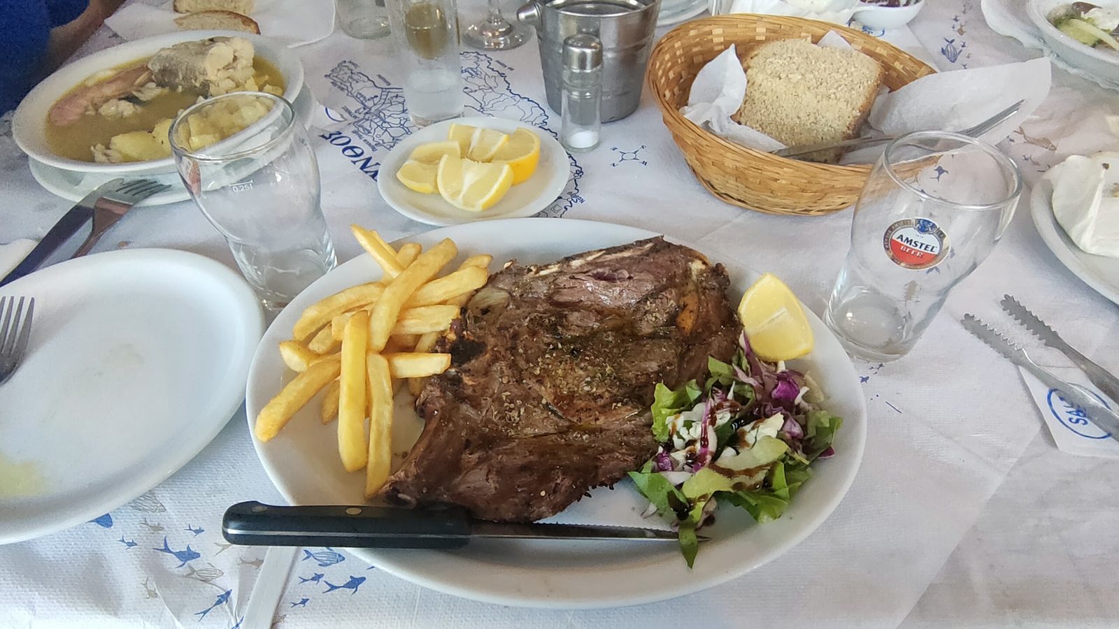 Supper in a taverna at Agios Nikolaos: grilled lamb, chips and salad