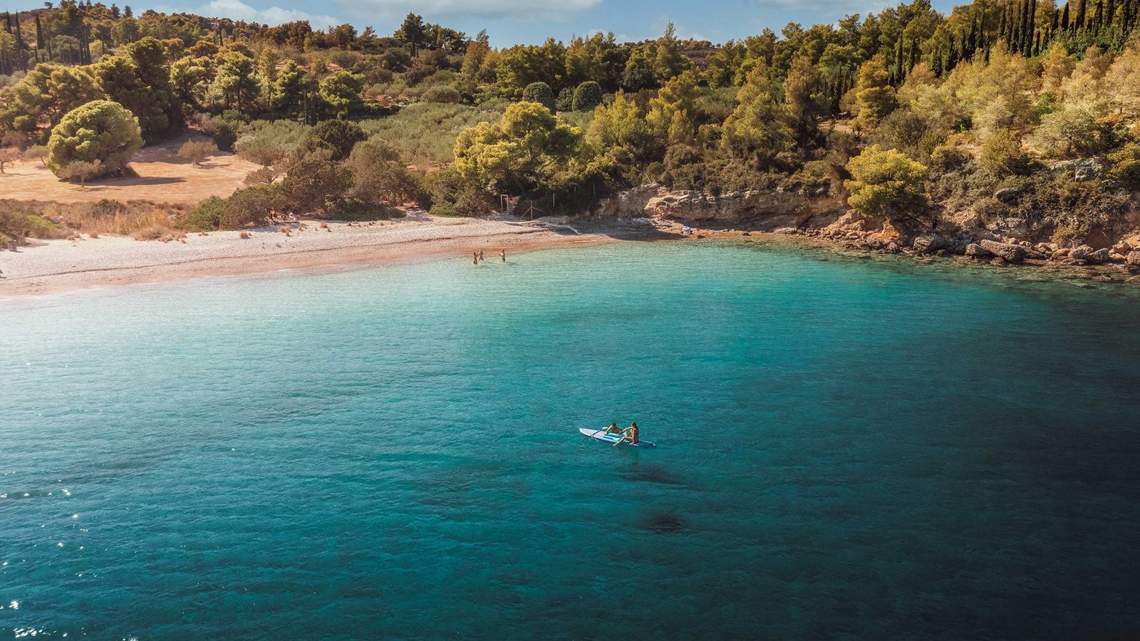 A quiet pebble cove near Ermioni, clear turquoise water